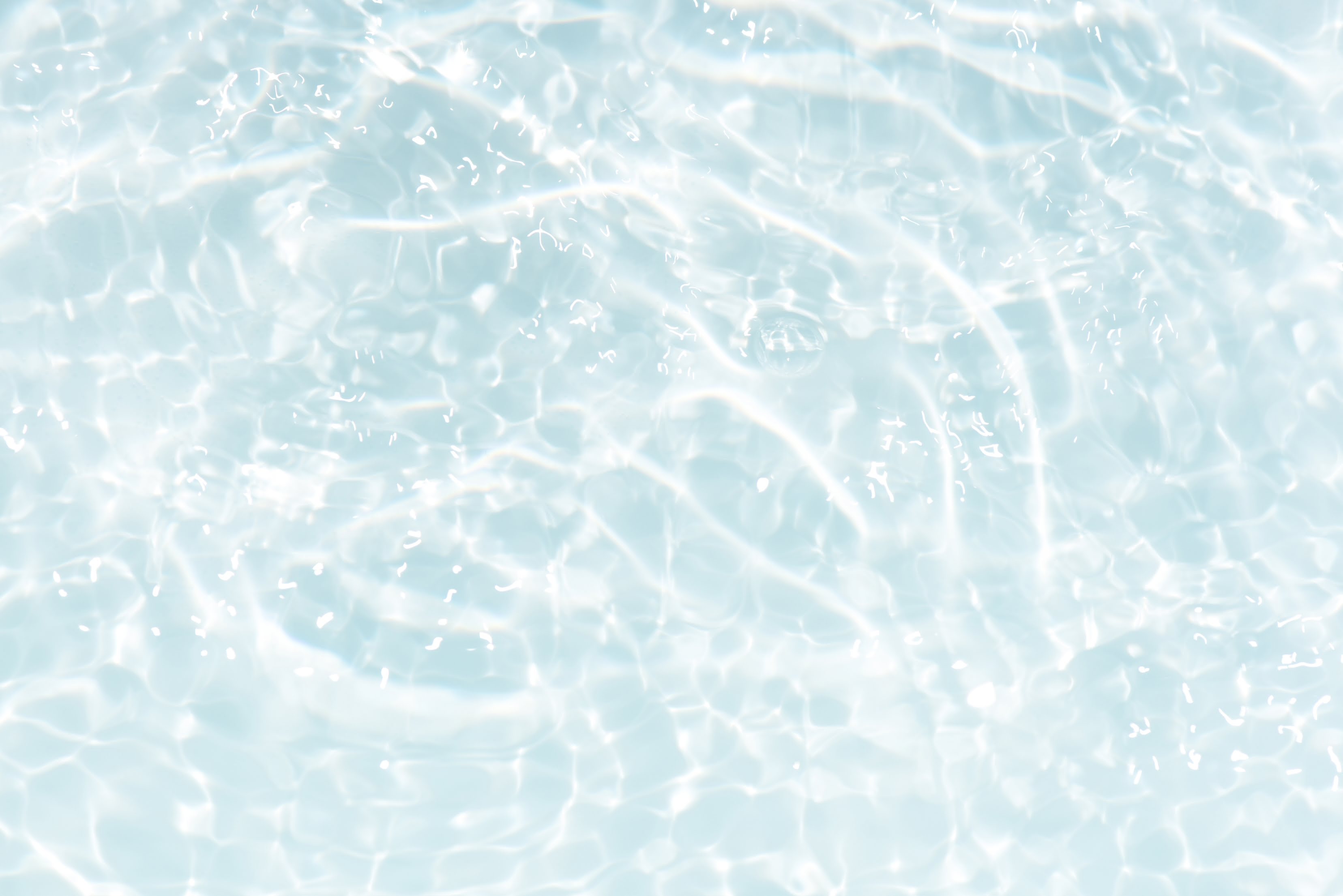 Crystal-clear light blue water symbolising hydration IV therapy — fast-acting infusion with electrolytes to restore fluid balance